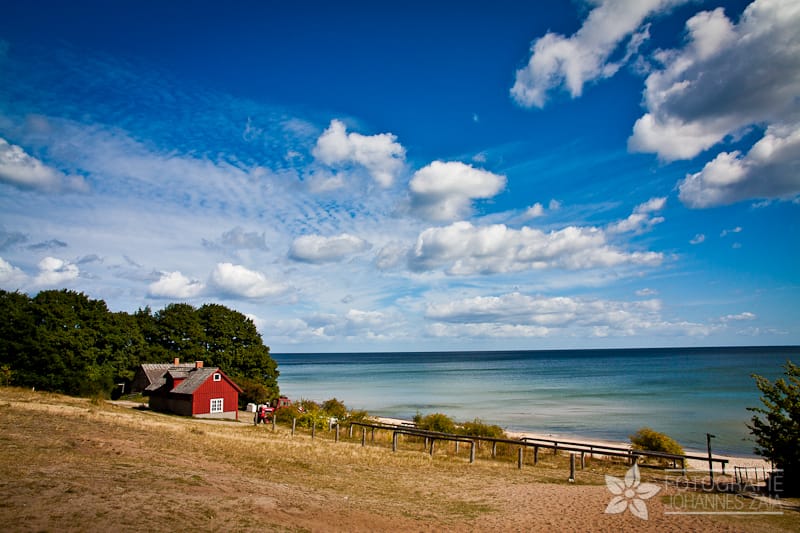 Red barn farm house near the ocean in Fulufjället National Park in Sweden.