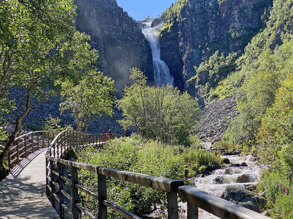 Bridge going across a creek that leads to a large water fall at Fulufjället National Park.