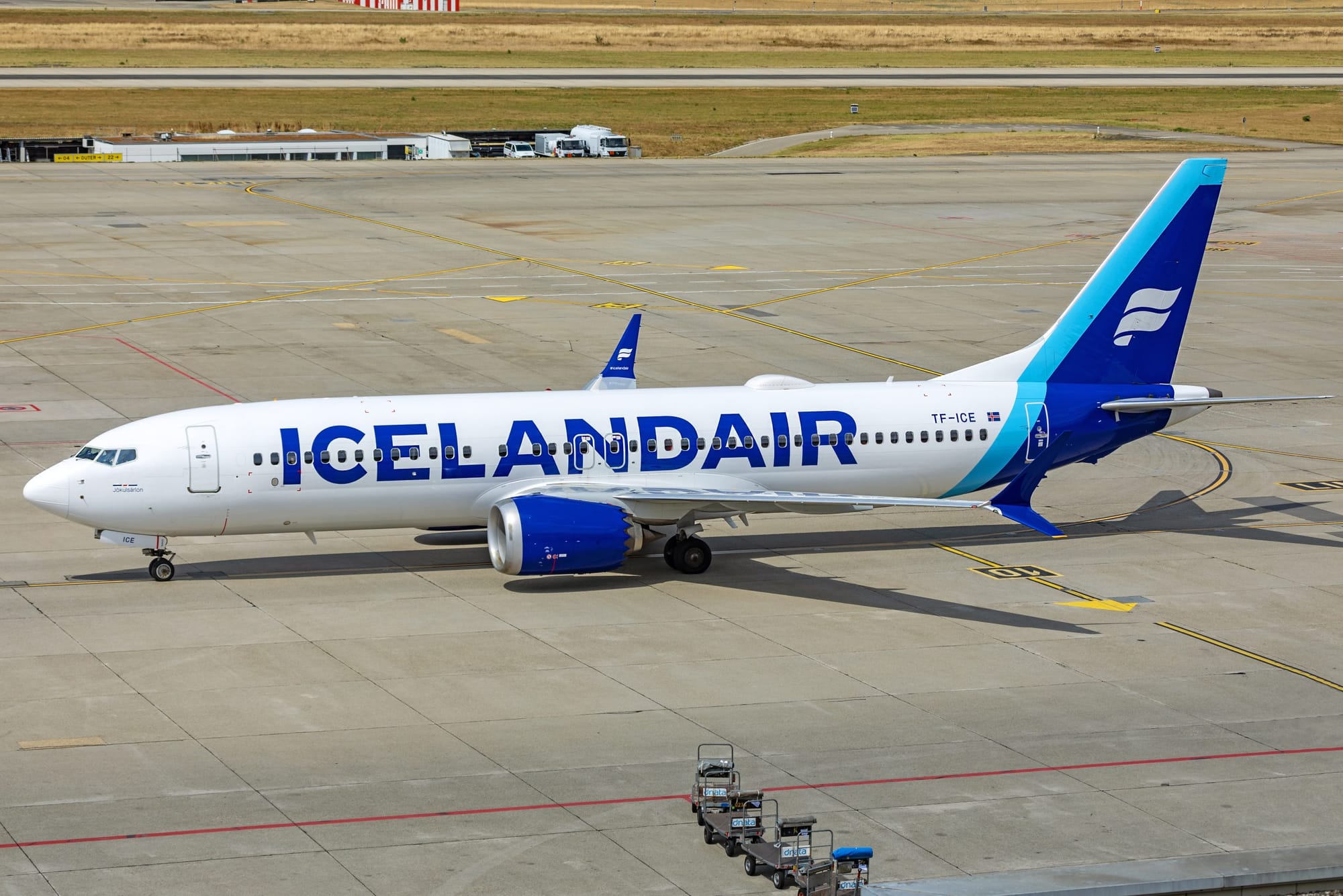 Icelandair Boeing 737 aircraft parked on airport tarmac with clear airline branding.