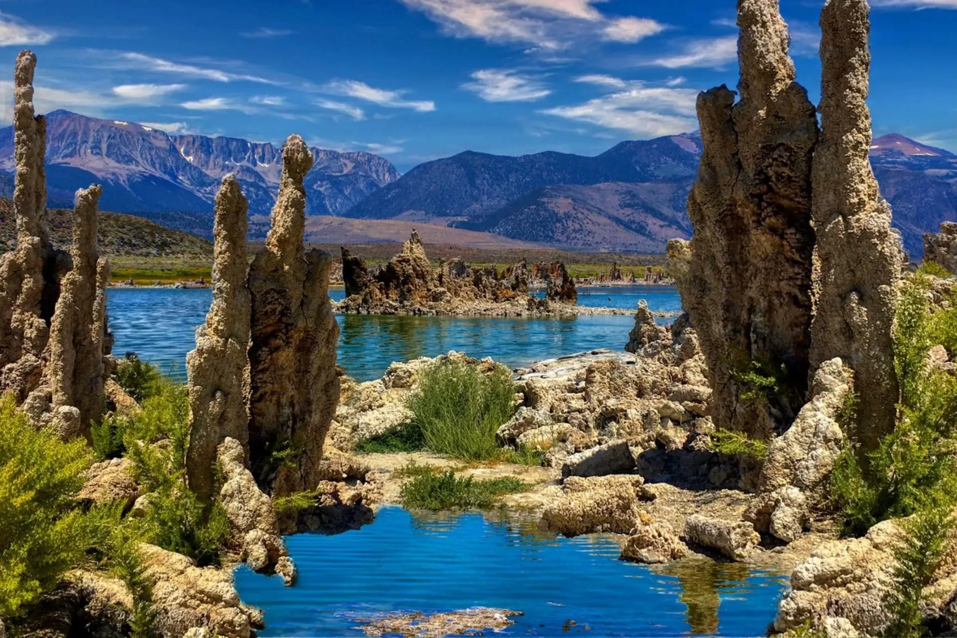 Surreal tufa rock formations rising from Mono Lake under a dramatic Sierra backdrop.