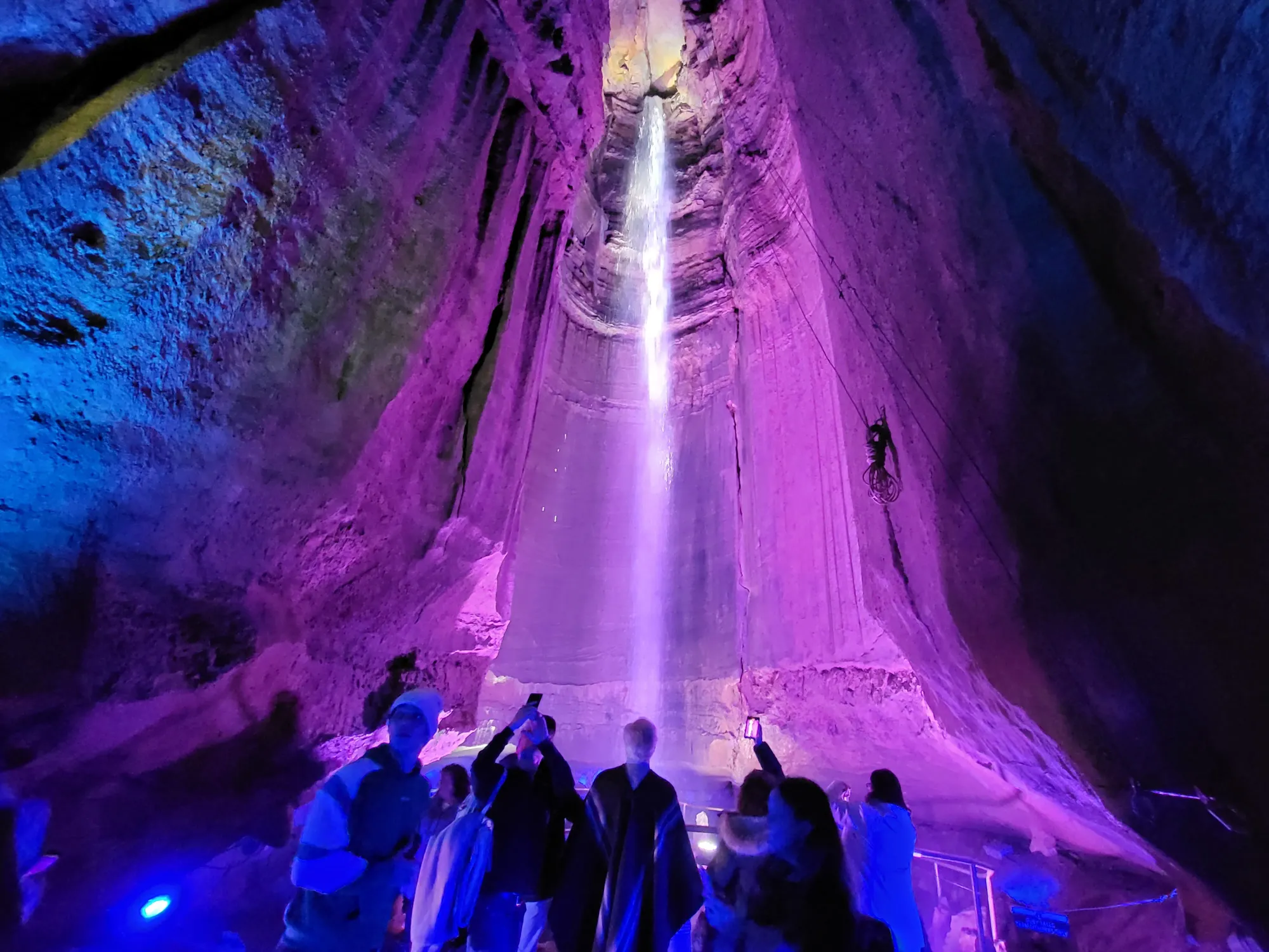 Ruby Falls illuminated in purple light, flowing inside a cavern deep beneath Lookout Mountain in Tennessee.