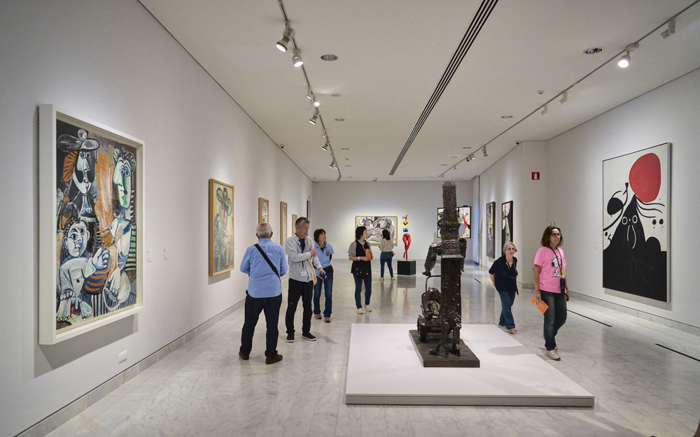 Visitors explore paintings and sculptures inside the Picasso Museum, located in the Gothic Quarter of Barcelona.