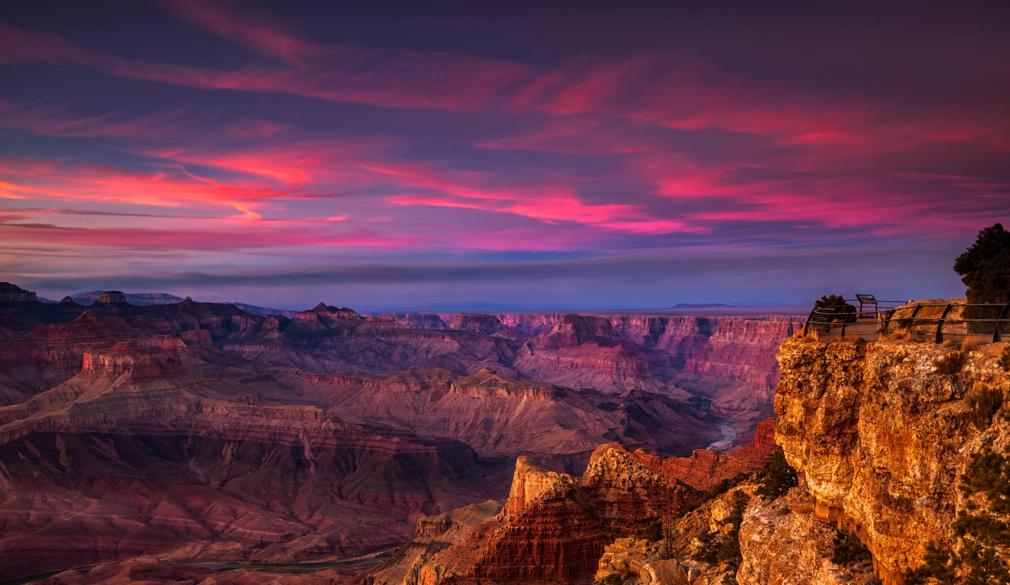 pink and purple sunset skies over the grand canyon.