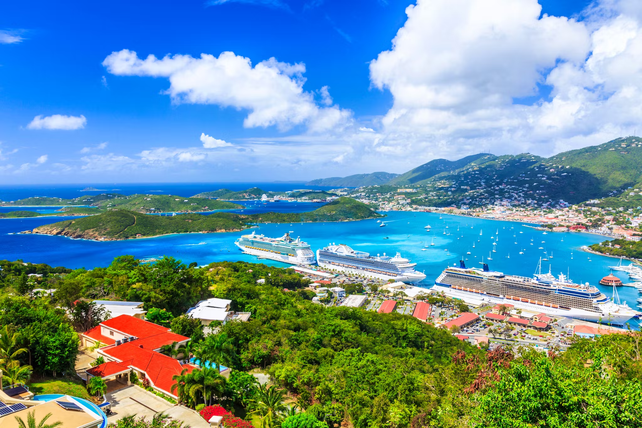 Ariel view of Havensight in St. Thomas with cruise ships docked in a beautiful bay.