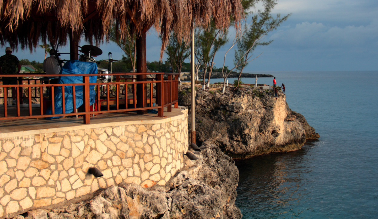 Cliff side thatched roof with with drums for a band playing at Ricks Cafe in Negril, Jamaica. 