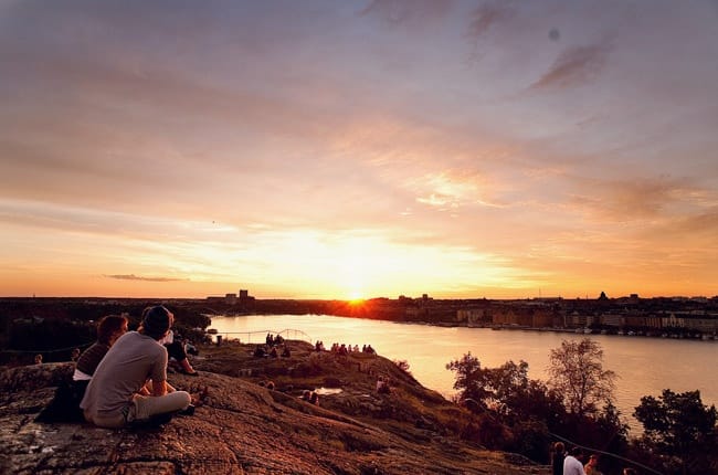 People watching the sunset from Skinnarviksberget in Stockholm, Sweden (City’s Highest Natural Point).