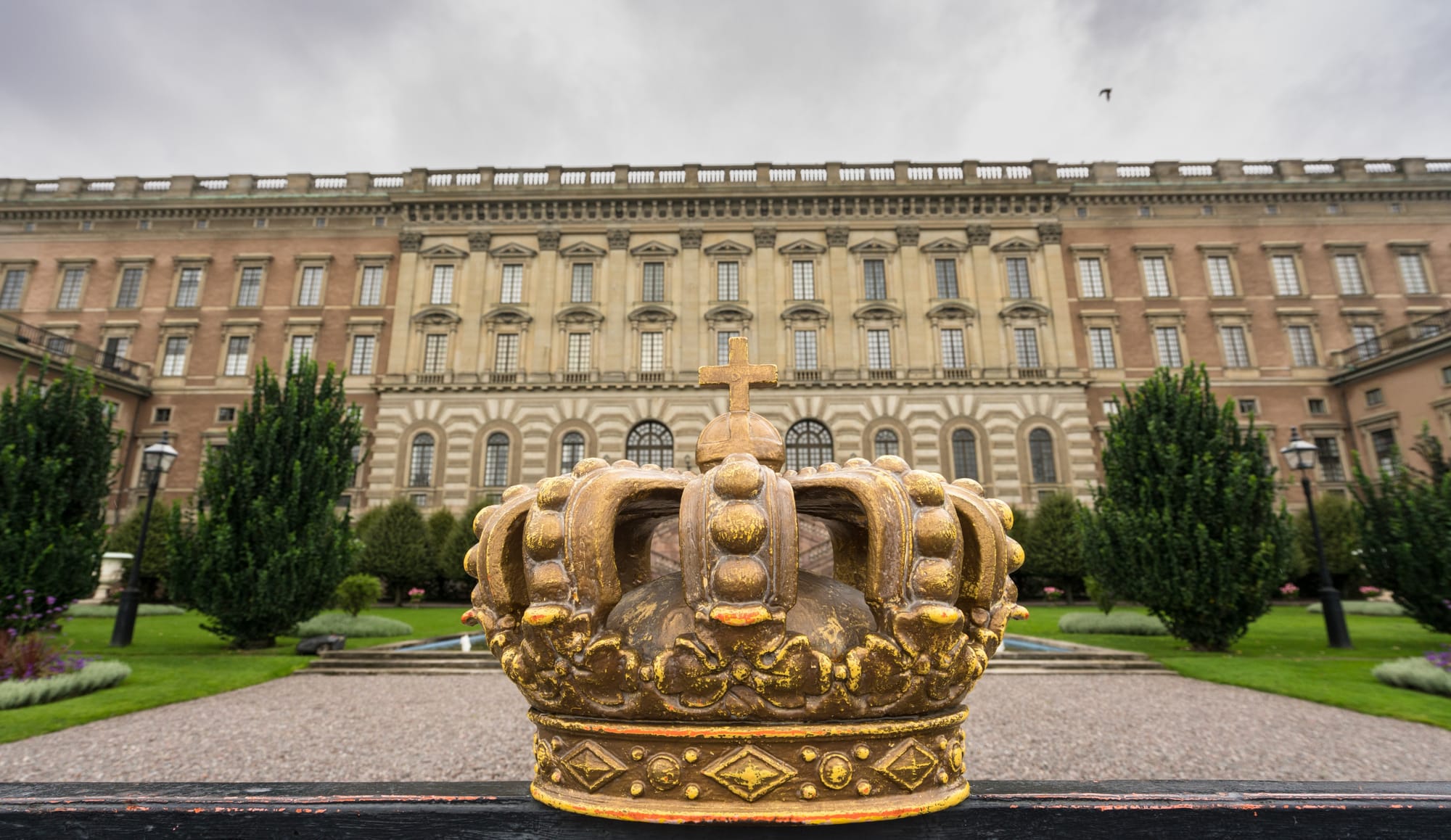 A golden crown in front of The Royal Palace Courtyard in Stockholm, Sweden.