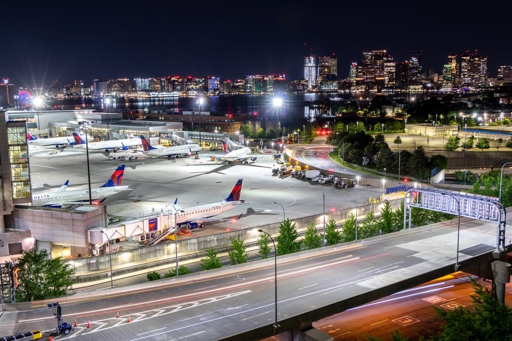Boston Logan Airport At Night Lit Up.