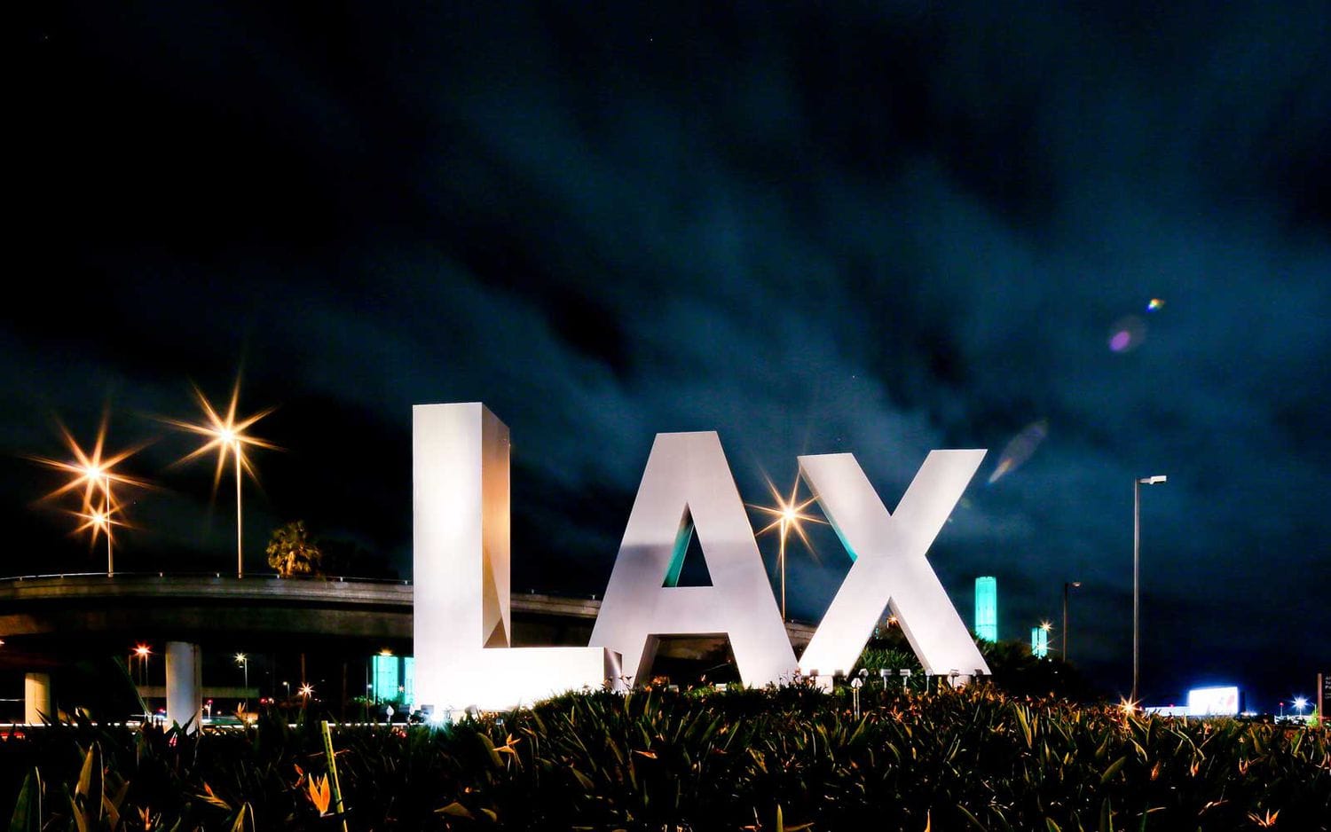 LAX Airport sign lit up at nights.