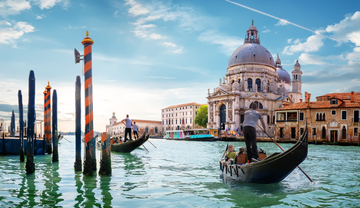 Man in a boat in Venice, Italy main grand Canal. 