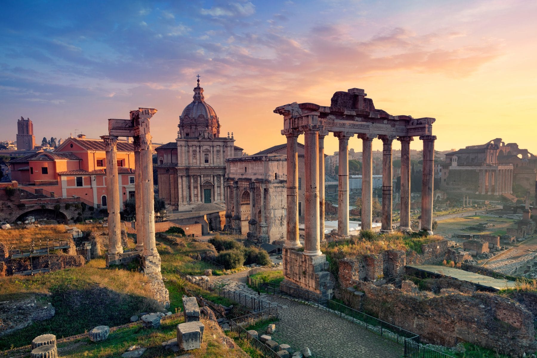 The roman forum at sunset in Rome.
