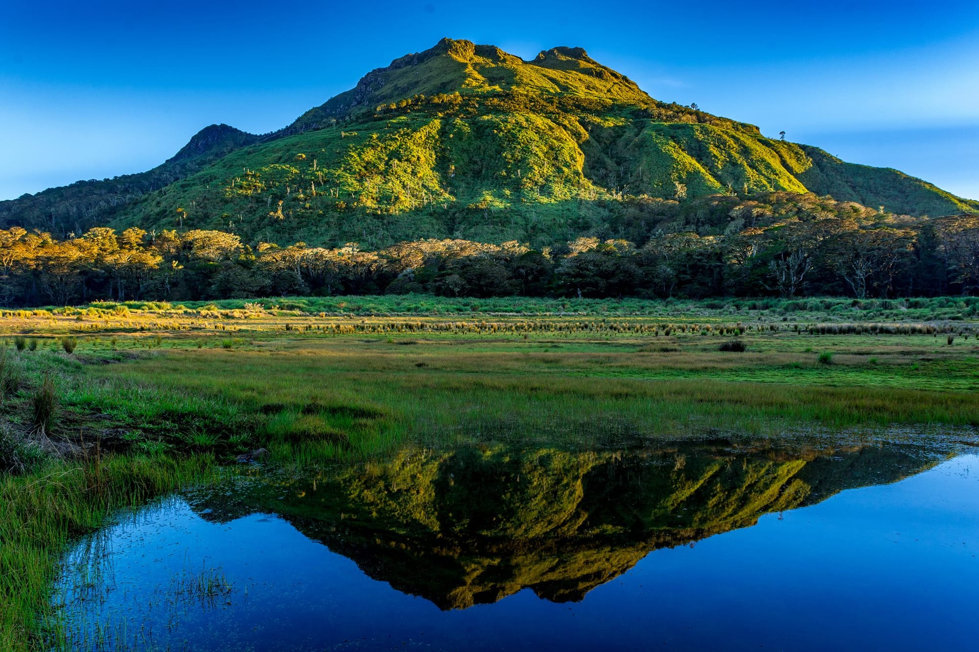 Reflection of a mountain on a lake at Mount Apo Natural Park
