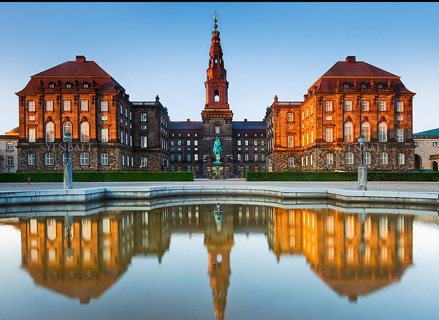 Christiansborg Palace reflecting off the water in Copenhagen, Denmark.