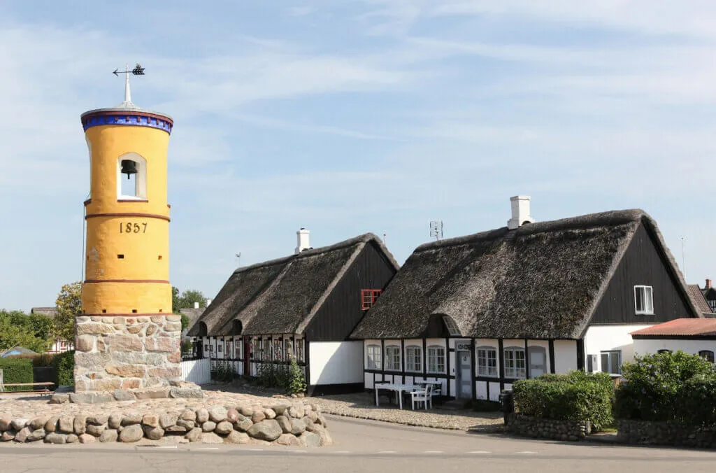 An old house and light house on Samsø Island, Denmark.