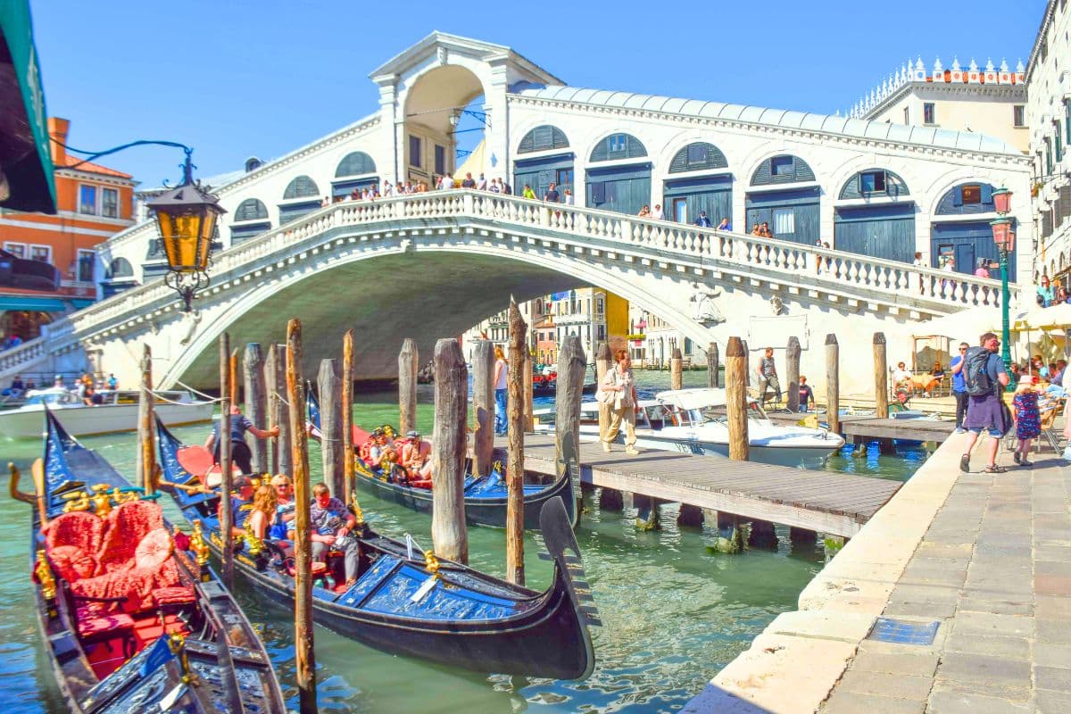 Tourist visiting Rialto Bridge in Venice, Italy.