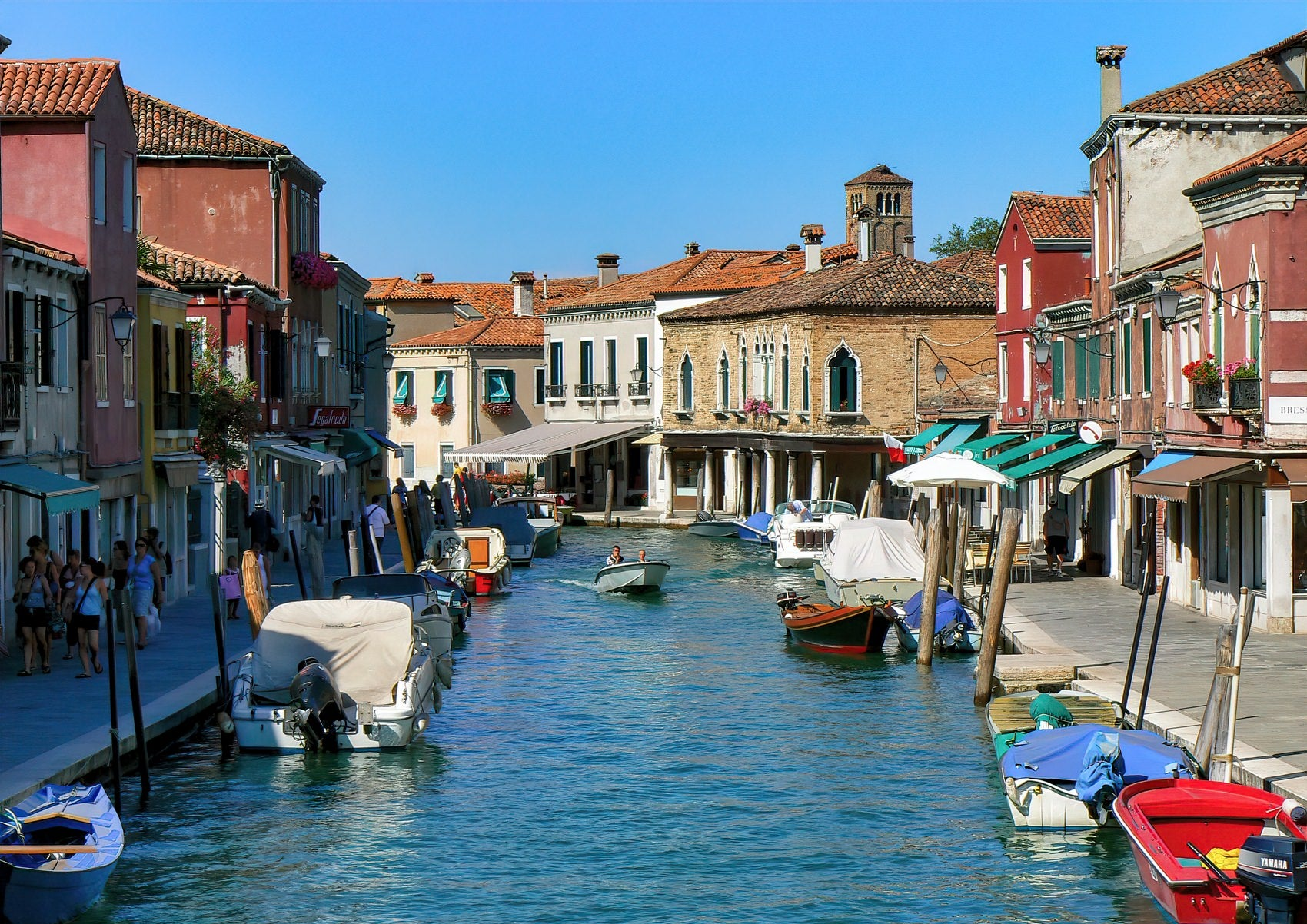 Boats on a canal in Murano Island near Venice, Italy.
