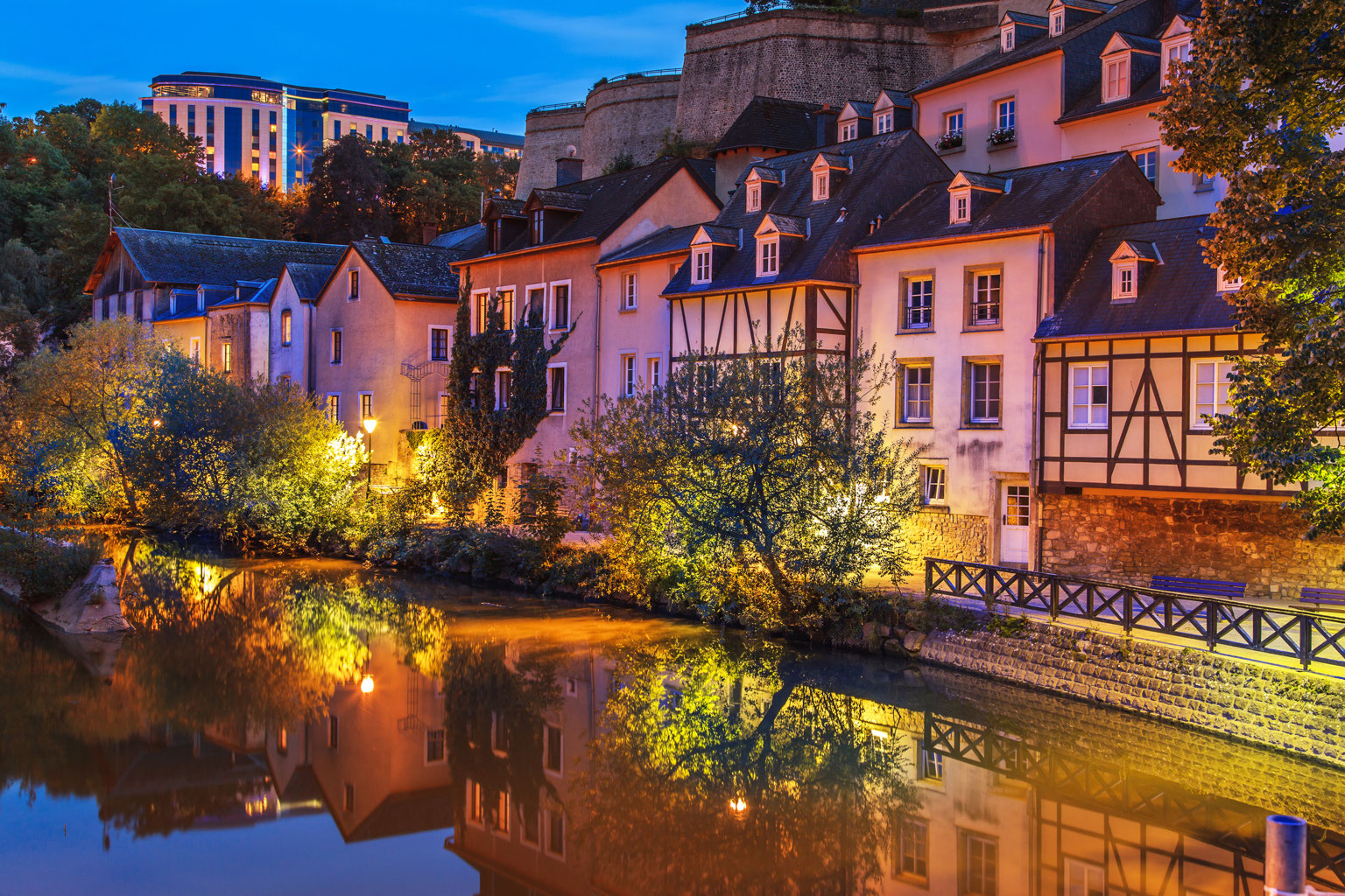 Luxembourg city on the river at night.