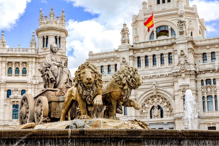 A sculpture of a woman being pulled by two lions that is what the Fountain of Cybele looks like. 