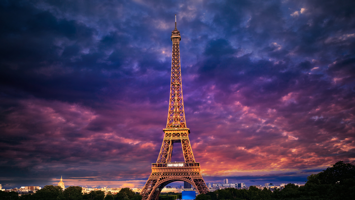 The Eiffel Tower at sunset in Paris, France.