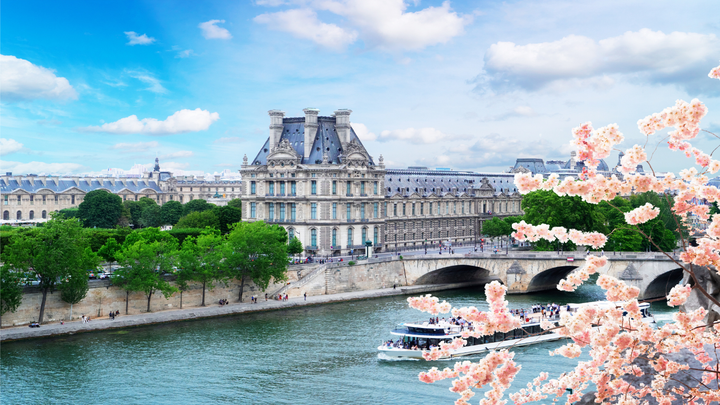 A boat going up the Sein River in Paris, France. 