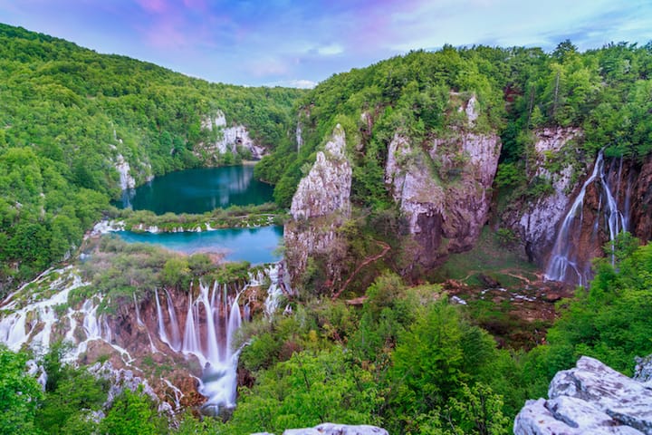 Multiple cascading waterfalls feed emerald pools at Plitvice Lakes, Croatia’s most breathtaking natural wonder.
