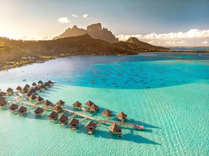 Over the water bungalows in Tahiti! Discover when they're cheapest and most expensive to visit.