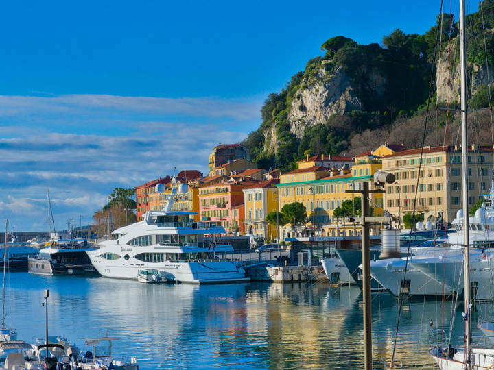 White Yachts anchored at a marina in Nice, France.