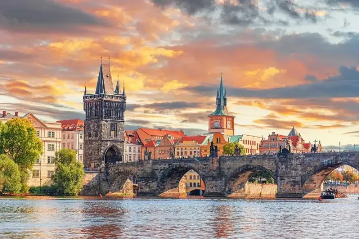 St. Charles Bridge and Prague Castle at sunset.