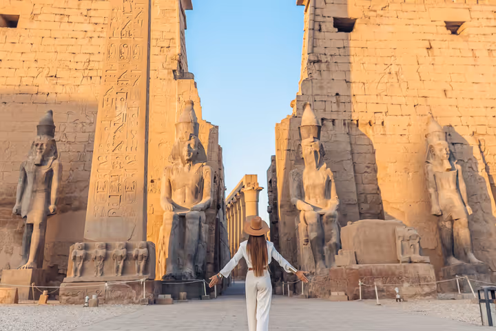 A woman exploring the ancient ruins in Egypt.