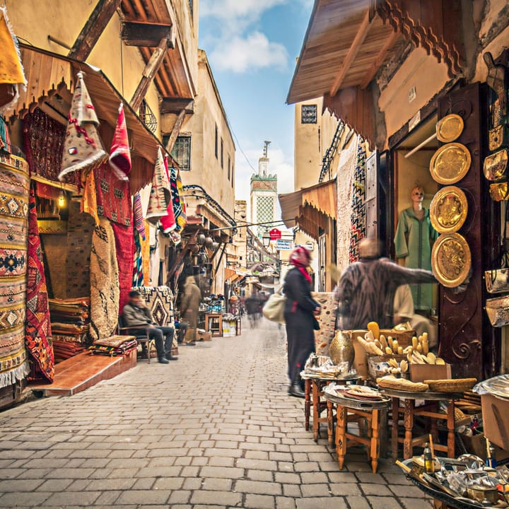 Woman exploring shopping markets in Morocco.