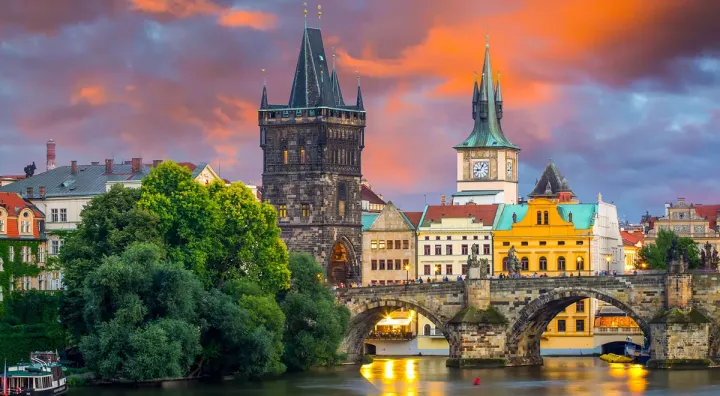 Beautiful sunset over St. Charles bridge in Prague.