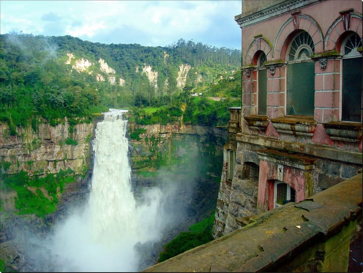 Waterfall view from the balcony of an old building in Colombia.